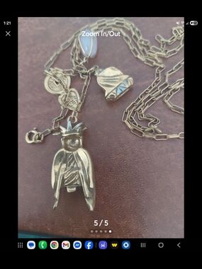 vintage charm necklace featuring Asian-inspired figural pendants